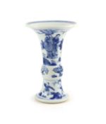 A Chinese blue and white beaker vase, gu, Kangxi period (1662-1722),finely painted with a swordsman