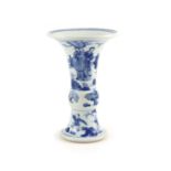 A Chinese blue and white beaker vase, gu, Kangxi period (1662-1722),finely painted with a swordsman