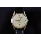 A gentleman's early 1960's 9ct gold Omega manual wind wrist watch,with quarterly Arabic numerals