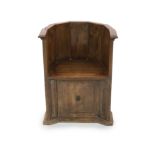 A late 16th century Italian walnut tub chair, possibly Tuscan, havingwith five-panel back and a