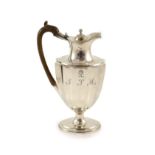 A George III silver hot water ewer, William Sumner I?,of panelled vase shape, with engraved initial