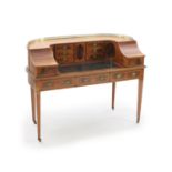 An Edwardian Sheraton revival satinwood banded mahogany Carlton House desk,with brass three quarter