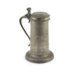 A mid-17th century pewter flagon of large proportionsWith wrythen thumbpiece and broad footH 31cm.