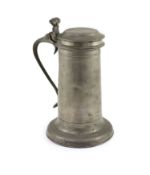 A mid-17th century pewter flagon of large proportionsWith wrythen thumbpiece and broad footH 31cm.