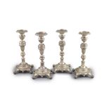 A set of four early 19th century South American? cast silver candlesticks,with waisted knop stems