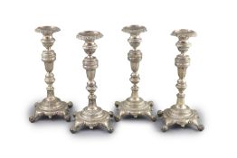 A set of four early 19th century South American? cast silver candlesticks,with waisted knop stems