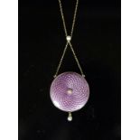 An Edwardian gold, pink guilloche enamel and seed pearl set drop circular pendant necklace,with