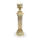 A pale cream onyx, gilt bronze and champlevé enamelled pedestal urn on swept supports with swag and