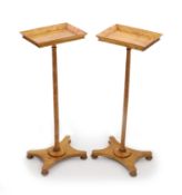 A pair of early Victorian satinwood flower stands,with galleried rectangular tops, on slender