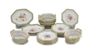 A Berlin porcelain dessert service, mid 19th century,each piece of octagonal shape, painted with