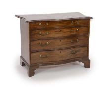 A George III serpentine mahogany chest,of four graduated long drawers, on bracket feet, Norman