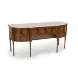 A large George III mahogany breakfront sideboard,with two central drawers flanked by a cupboard and