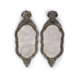 A pair of 19th century Venetian glass and silvered wood wall mirrors,of hour glass cartouche form