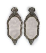 A pair of 19th century Venetian glass and silvered wood wall mirrors,of hour glass cartouche form