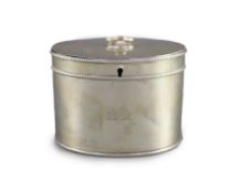 A George III silver oval tea caddy by John Younge & Co,with engraved crest, ring handle and beaded