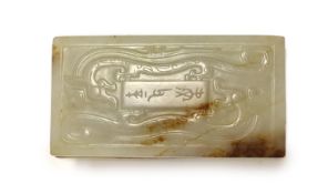 A Chinese archaistic white and brown jade box and cover,the cover carved in low relief with an