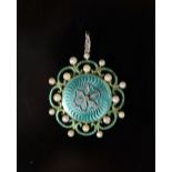 A Belle Epoque gold, green enamel, seed pearl and rose cut diamond set circular pendant,with glazed