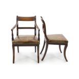 A set of fourteen Regency and later mahogany dining chairs, including two carvers,with reeded