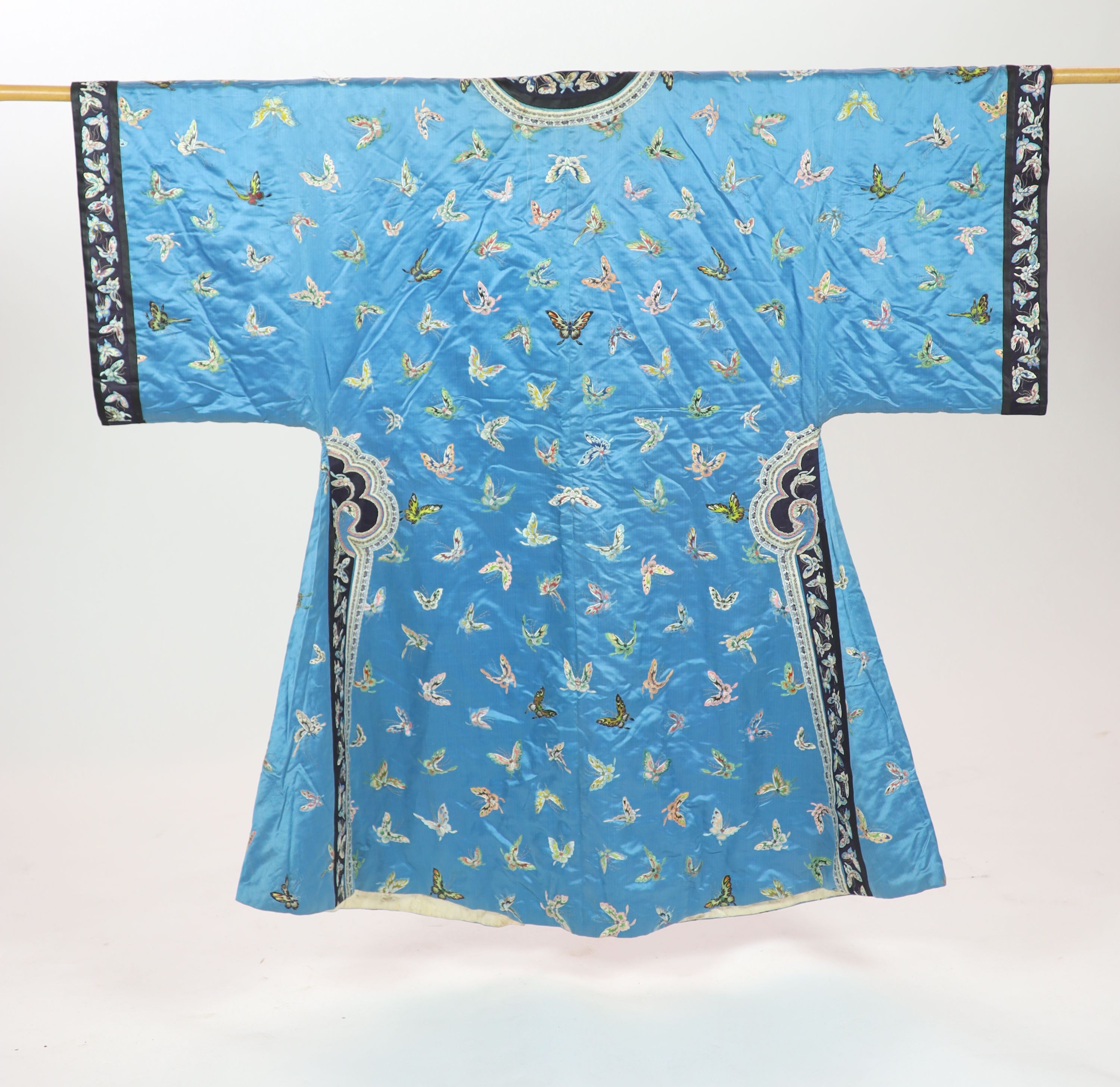 A Chinese blue silk ‘butterfly’ Winter robe, late 19th century,embroidered with butterflies on a - Image 2 of 7