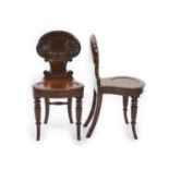 A pair of Regency mahogany hall chairs, attributed to Gillows,with deeply scalloped shell backs,