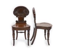 A pair of Regency mahogany hall chairs, attributed to Gillows,with deeply scalloped shell backs,