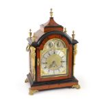 A late Victorian faux tortoiseshell and ebonised mantel clockwith brass dial to striking and