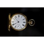 A late Victorian engine turned 18ct gold A W. Co Waltham hunter keyless lever pocket watch,with