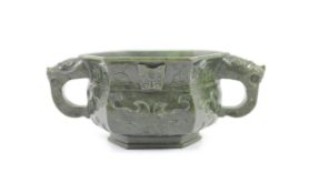 A Chinese archaistic spinach green jade hexagonal censer, 19th century,carved in relief with taotie