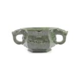 A Chinese archaistic spinach green jade hexagonal censer, 19th century,carved in relief with taotie