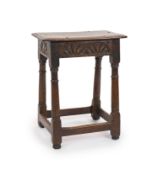 A Charles II oak joint stool,with moulded seat, unit carved freize and turned legsH 57cm. W 46cm. D