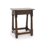A Charles II oak joint stool,with moulded seat, unit carved freize and turned legsH 57cm. W 46cm. D
