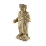 A Cypriot carved limestone Votive figure of a Goddess, 7th century B.C.,standing wearing a laurel