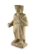 A Cypriot carved limestone Votive figure of a Goddess, 7th century B.C.,standing wearing a laurel