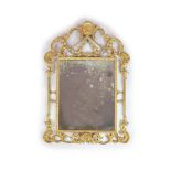 A George III style carved giltwood wall mirror,with rectangular plate and pierced foliate scroll