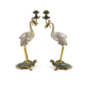 A pair of Chinese cloisonné enamel and gilt bronze ’crane’ candlesticks, early 20th century,each