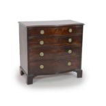 A George III mahogany serpentine chest of four graduated long drawers,with circular brass loop