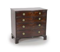 A George III mahogany serpentine chest of four graduated long drawers,with circular brass loop