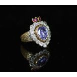 A 19th century gold, pear shaped sapphire, ruby and old cut diamond set flaming heart ring,with