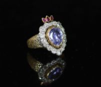 A 19th century gold, pear shaped sapphire, ruby and old cut diamond set flaming heart ring,with