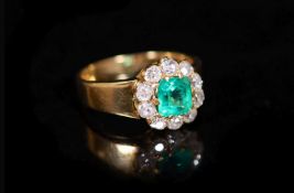 A gold, emerald and old cut diamond set circular cluster ring,size O/P, gross weight 6.3 grams.