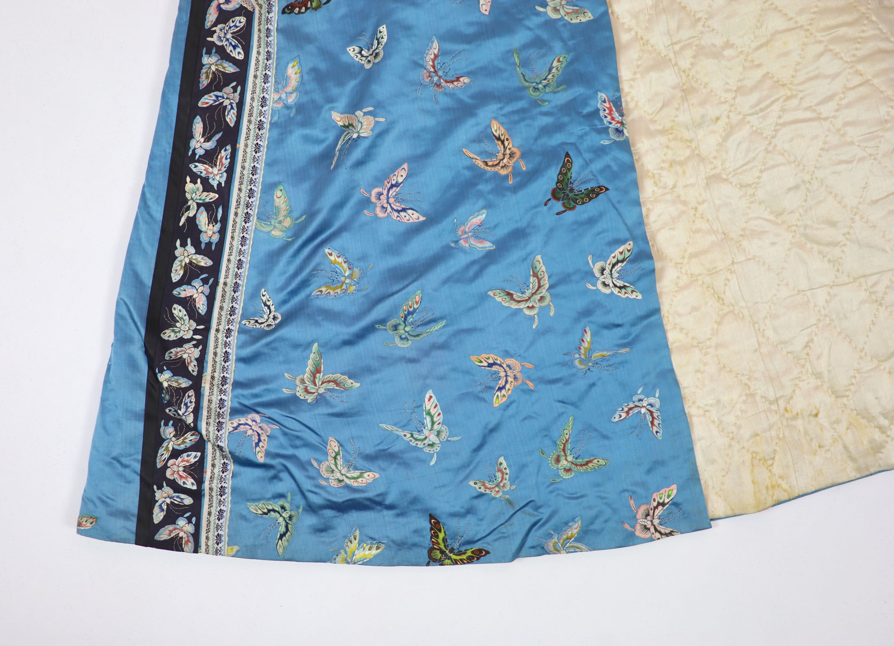 A Chinese blue silk ‘butterfly’ Winter robe, late 19th century,embroidered with butterflies on a - Image 3 of 7