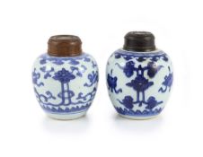 A near pair of Chinese blue and white ovoid jars, Kangxi period,each painted with ribbon tied