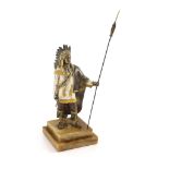 After Carl Kauba, a gilded, silvered and patinated bronze figure of a Native American chieftain,