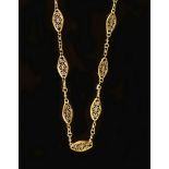 An early 20th century French 18ct gold, pierced navette shaped fancy link long necklace.149cm,