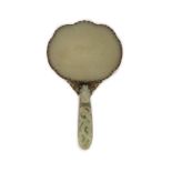 A Chinese pale celadon jade mounted hand mirror, the jade 18th/19th century,the back of the mirror