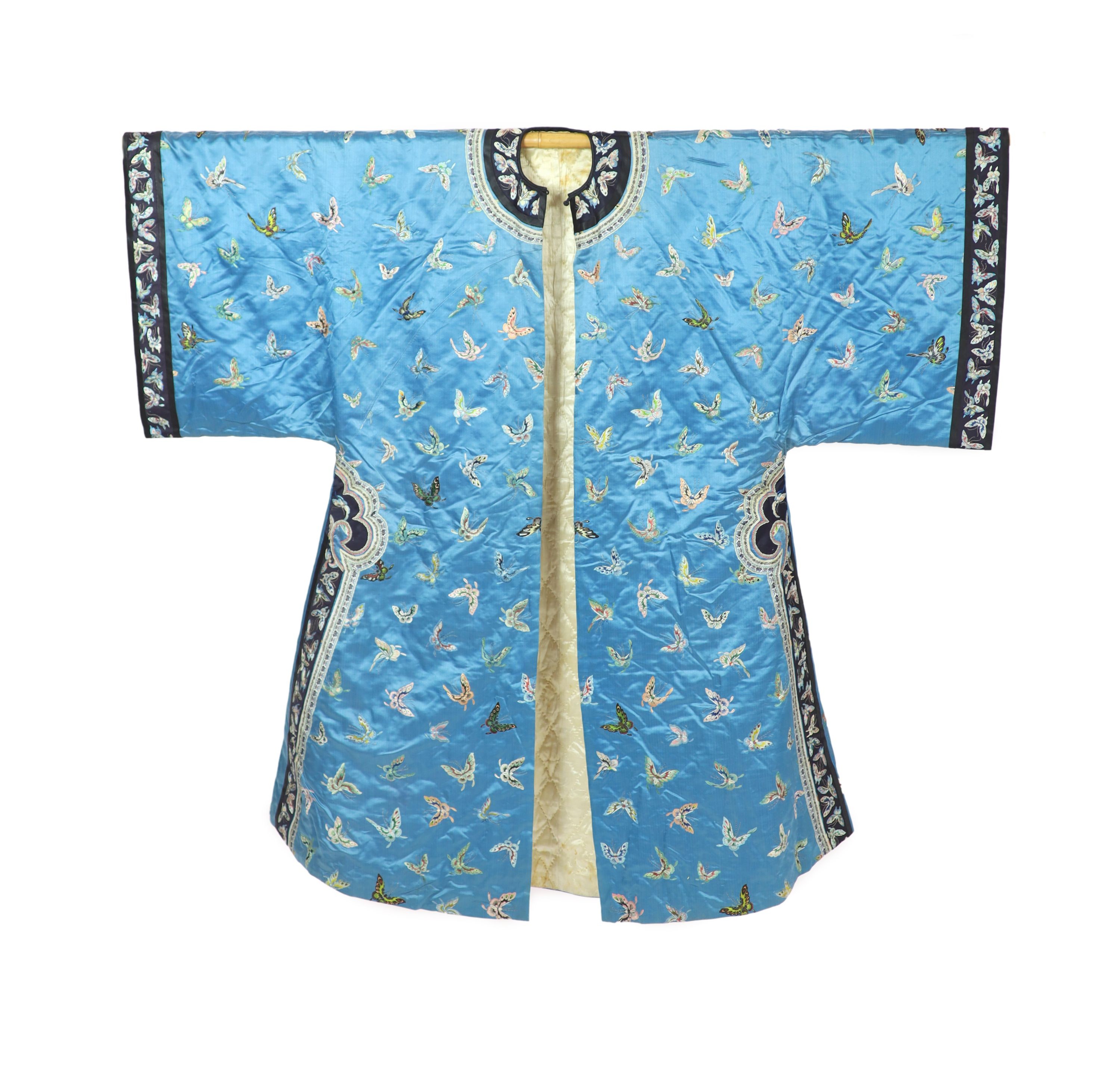 A Chinese blue silk ‘butterfly’ Winter robe, late 19th century,embroidered with butterflies on a