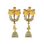 A pair of elaborate gilt metal and green onyx six-light candelabra table lamps on pedestal urn