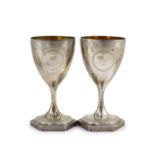 A pair of George III silver goblets, by Benjamin Mountigue,with engraved decoration and armorial,