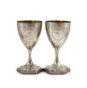 A pair of George III silver goblets, by Benjamin Mountigue,with engraved decoration and armorial,