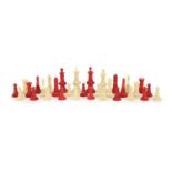 A 19th century Anglo-Indian white and stained bone chess set, with unusual carved palmate
